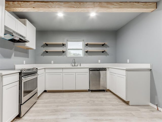 kitchen with under cabinet range hood, open shelves, a sink, and appliances with stainless steel finishes