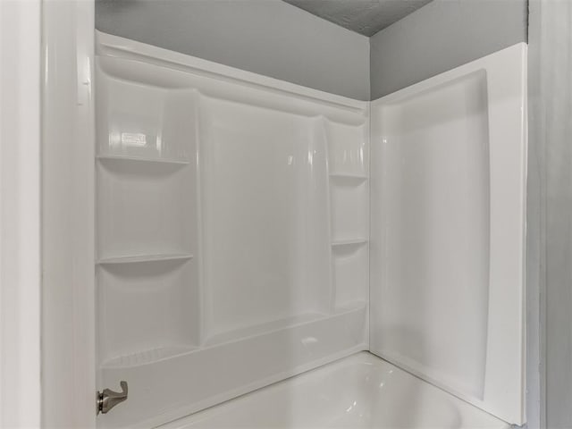 full bath featuring bathing tub / shower combination