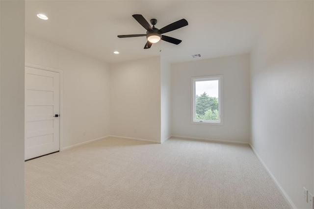 6516 NE 97th St, Oklahoma City, OK 73151 - empty room featuring light colored carpet, a ceiling fan, and recessed lighting