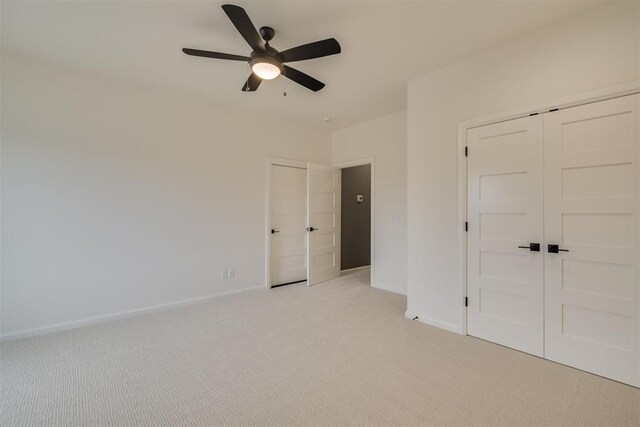 6516 NE 97th St, Oklahoma City, OK 73151 - unfurnished bedroom featuring light carpet, ceiling fan, and a closet