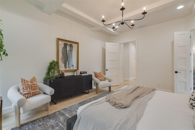 6516 NE 97th St, Oklahoma City, OK 73151 - bedroom featuring a chandelier, light wood-style floors, and beam ceiling