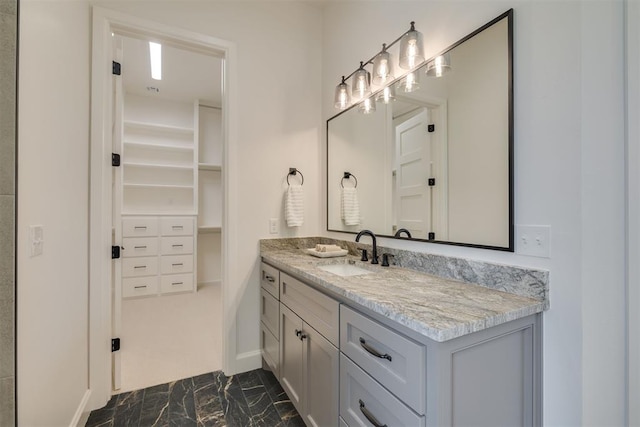 6516 NE 97th St, Oklahoma City, OK 73151 - bathroom featuring marble finish flooring, vanity, and a spacious closet