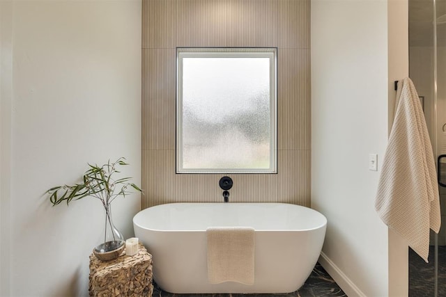 6516 NE 97th St, Oklahoma City, OK 73151 - full bathroom with a freestanding tub and marble finish flooring