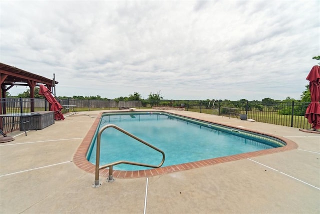 view of pool featuring a patio and fence