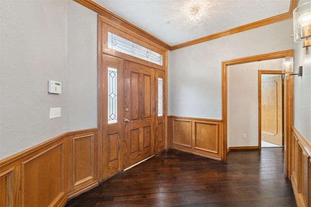 entryway featuring wainscoting, dark wood-style floors, and crown molding