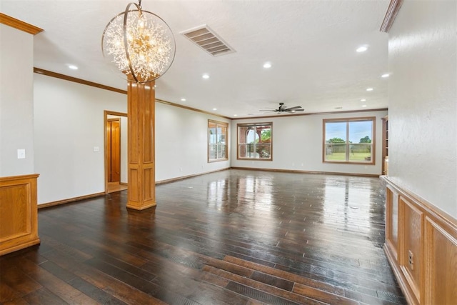 unfurnished living room featuring wood-type flooring, ceiling fan, crown molding, recessed lighting, and a chandelier
