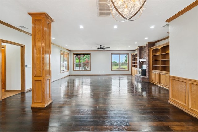 unfurnished living room featuring crown molding, ornate columns, dark wood-style flooring, recessed lighting, and ceiling fan
