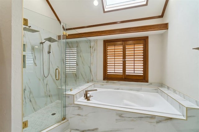 full bathroom featuring a marble finish shower, a bath, and a skylight