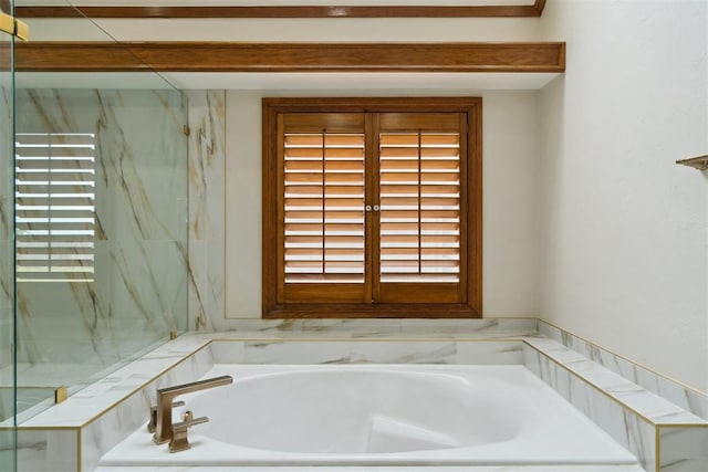 full bathroom with a bath