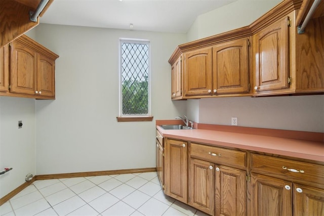 clothes washing area with cabinet space, baseboards, and electric dryer hookup
