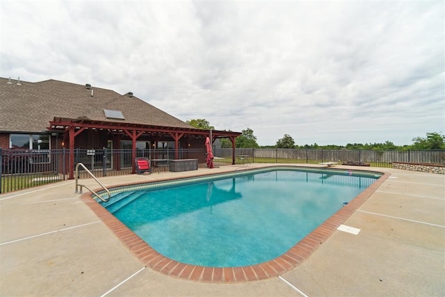 view of swimming pool featuring a patio area, a pergola, and fence