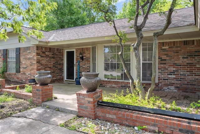 6408 Brentford Ter, Oklahoma City, OK 73132 - view of front of home with brick siding and a shingled roof