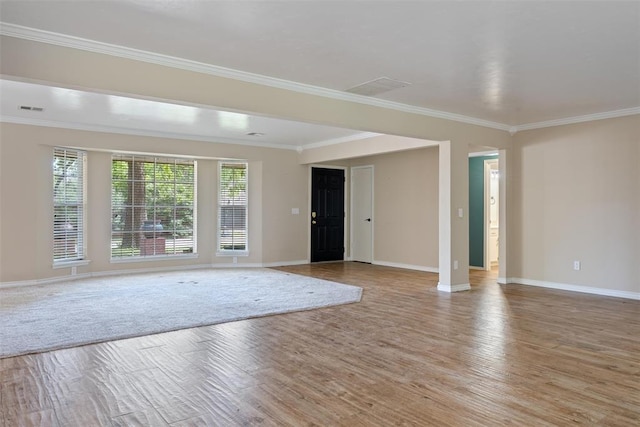 6408 Brentford Ter, Oklahoma City, OK 73132 - unfurnished living room with baseboards, light wood-style floors, and ornamental molding