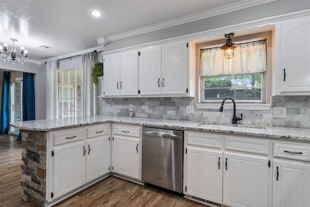 6408 Brentford Ter, Oklahoma City, OK 73132 - kitchen with stainless steel dishwasher, a sink, crown molding, a chandelier, and white cabinetry