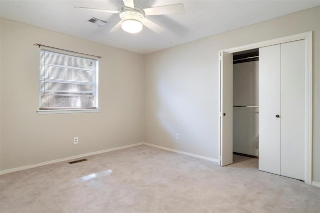 6408 Brentford Ter, Oklahoma City, OK 73132 - unfurnished bedroom with light carpet, a closet, baseboards, and a ceiling fan