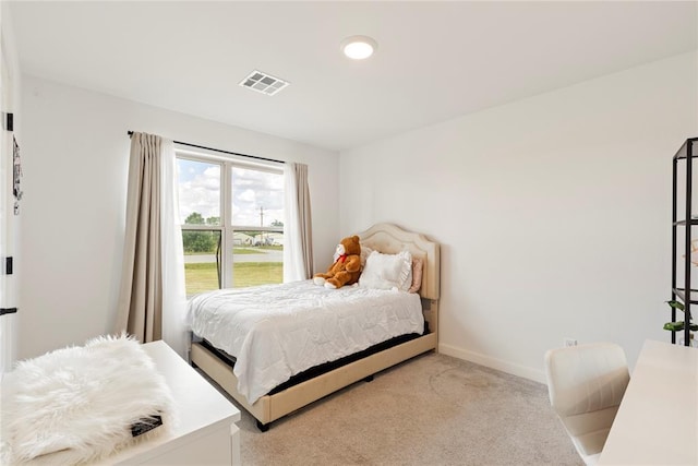 bedroom with carpet and baseboards