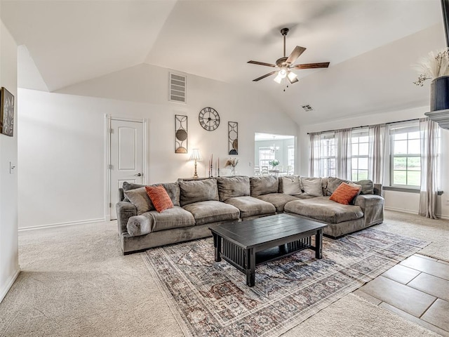 carpeted living room with vaulted ceiling, a ceiling fan, and baseboards