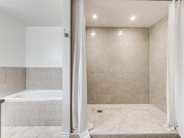 full bathroom featuring a garden tub, tiled shower, recessed lighting, and tile patterned floors