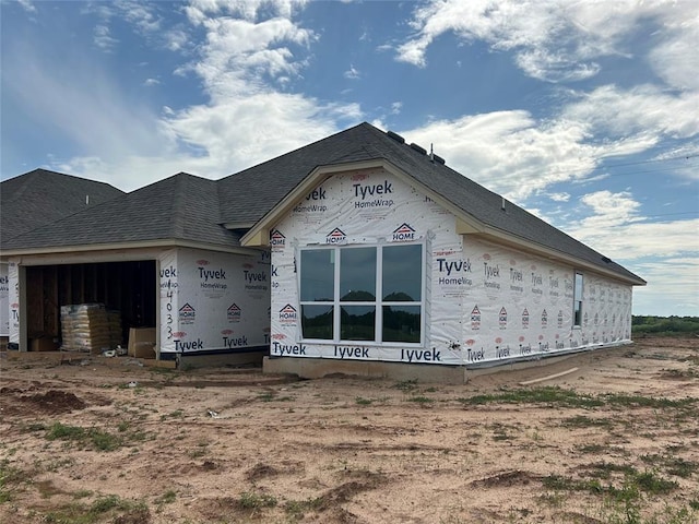 14033 Giverny Ave, Yukon, OK 73099 - view of front of house with roof with shingles and an attached garage
