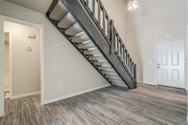 7301 Kings Manor Ct, Oklahoma City, OK 73132 - entrance foyer with stairway, wood finished floors, and baseboards