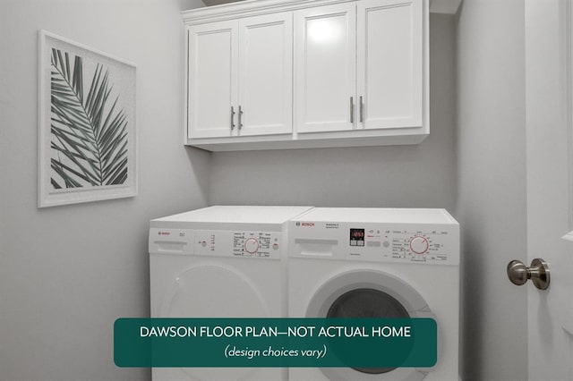 laundry room featuring washer and clothes dryer and cabinet space