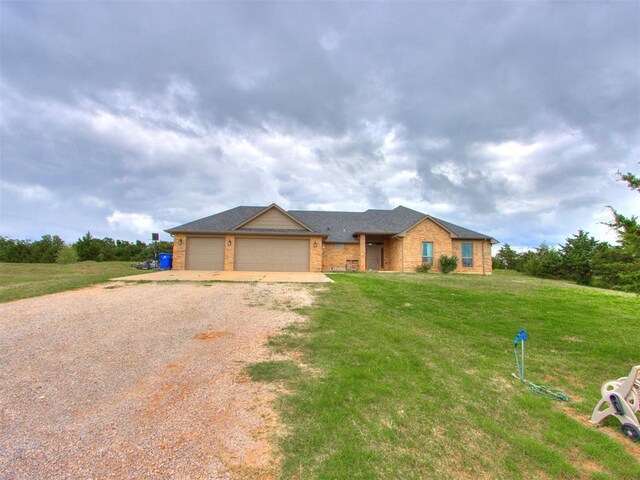 5702 Cedar Tree Cir, Guthrie, OK 73044 - ranch-style home featuring driveway, brick siding, a garage, and a front yard