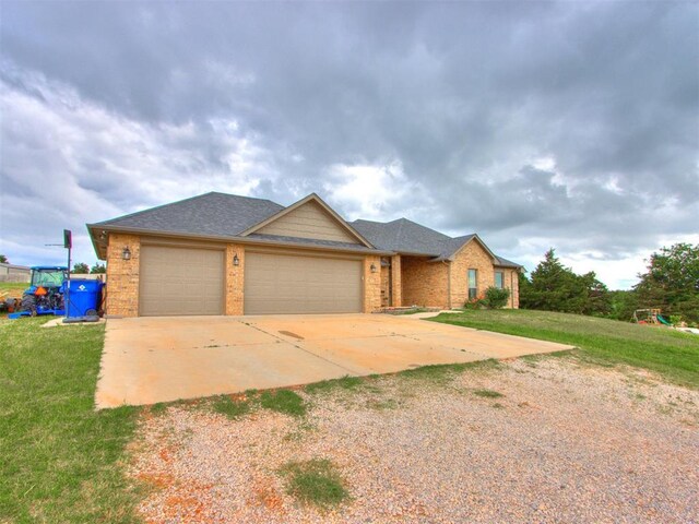 5702 Cedar Tree Cir, Guthrie, OK 73044 - single story home featuring brick siding, a front lawn, an attached garage, and driveway