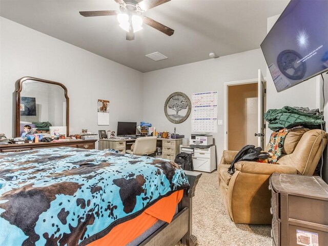 5702 Cedar Tree Cir, Guthrie, OK 73044 - bedroom featuring light carpet and ceiling fan
