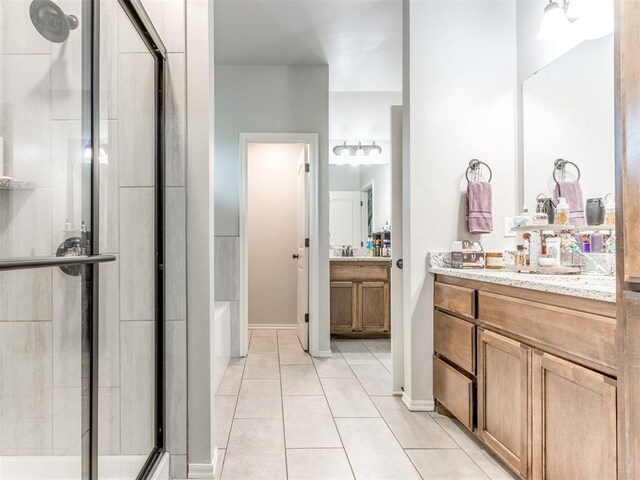 5702 Cedar Tree Cir, Guthrie, OK 73044 - full bathroom featuring a stall shower, tile patterned floors, vanity, and a tub to relax in