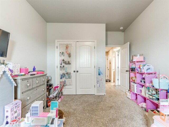 5702 Cedar Tree Cir, Guthrie, OK 73044 - bedroom with carpet floors and a closet
