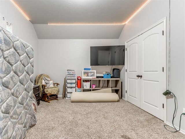 5702 Cedar Tree Cir, Guthrie, OK 73044 - bedroom with lofted ceiling, carpet floors, and baseboards