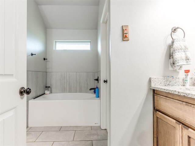 5702 Cedar Tree Cir, Guthrie, OK 73044 - bathroom featuring a bath, tile patterned flooring, and vanity