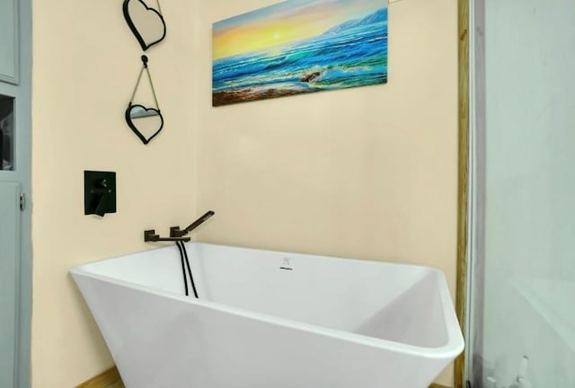full bathroom with a freestanding tub