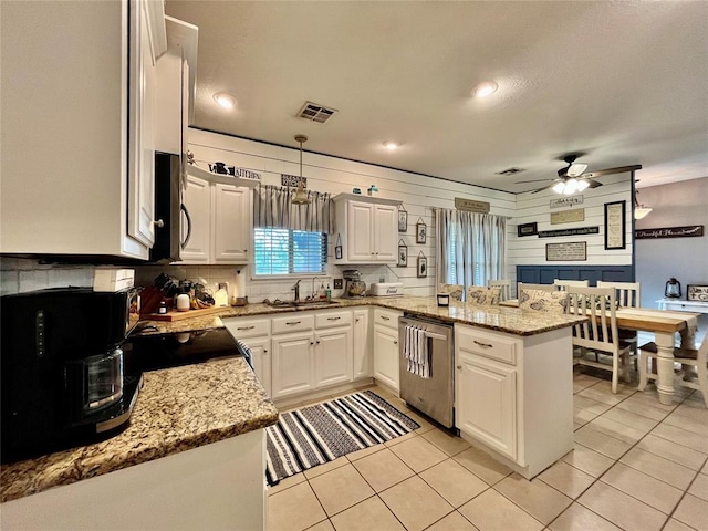 kitchen featuring stainless steel appliances, a peninsula, a ceiling fan, white cabinetry, and recessed lighting