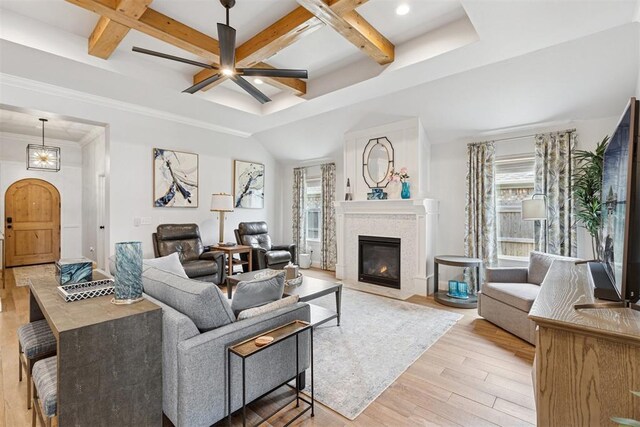 16309 Rangeland Dr, Oklahoma City, OK 73170 - living room with coffered ceiling, light wood-type flooring, plenty of natural light, a ceiling fan, and a fireplace