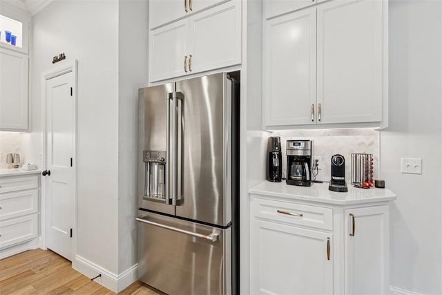 16309 Rangeland Dr, Oklahoma City, OK 73170 - kitchen featuring high end refrigerator, baseboards, and white cabinets