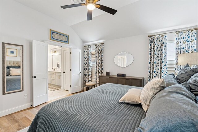 16309 Rangeland Dr, Oklahoma City, OK 73170 - bedroom with light wood-type flooring, baseboards, vaulted ceiling, connected bathroom, and a ceiling fan