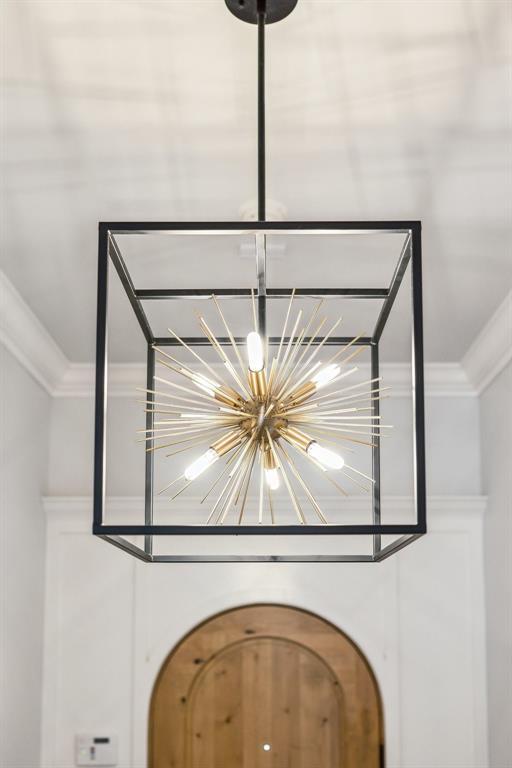 16309 Rangeland Dr, Oklahoma City, OK 73170 - detailed view of a chandelier and crown molding