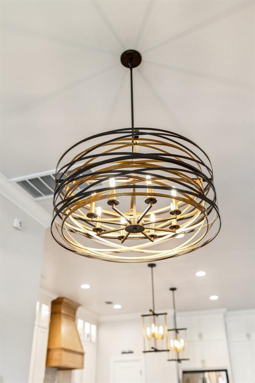 16309 Rangeland Dr, Oklahoma City, OK 73170 - detailed view of a chandelier, crown molding, and recessed lighting