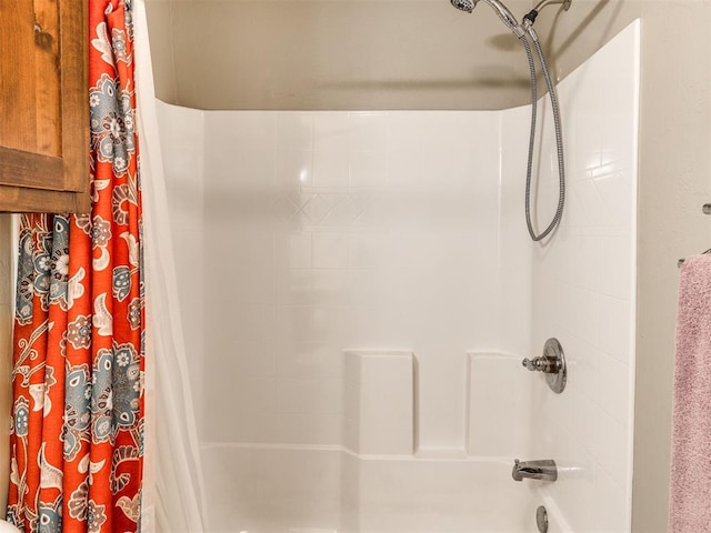 bathroom with shower / tub combo with curtain