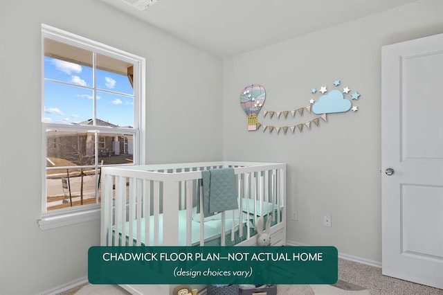 bedroom with a crib and baseboards