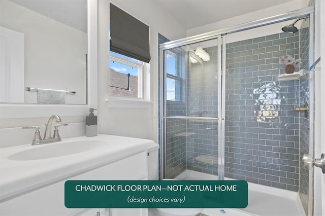 full bath featuring a stall shower, toilet, and vanity