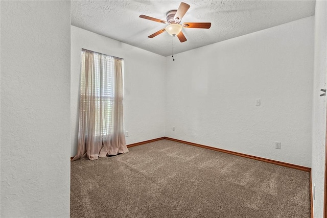 2001 Saber Ln, Weatherford, OK 73096 - unfurnished room with carpet, a textured wall, a ceiling fan, a textured ceiling, and baseboards