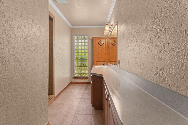 2001 Saber Ln, Weatherford, OK 73096 - hall with a textured wall, ornamental molding, a sink, a textured ceiling, and light tile patterned floors