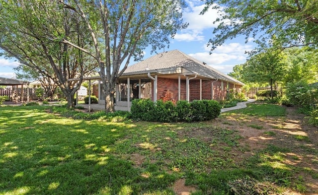 2001 Saber Ln, Weatherford, OK 73096 - view of property exterior featuring brick siding