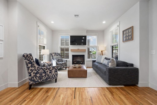 43 Center Ln, Carlton Landing, OK 74432 - living room featuring wood finished floors, baseboards, a fireplace, and recessed lighting