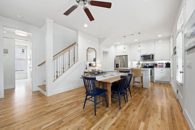 43 Center Ln, Carlton Landing, OK 74432 - dining space with light wood-style flooring, a ceiling fan, stairs, baseboards, and recessed lighting