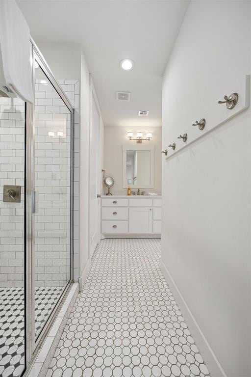 43 Center Ln, Carlton Landing, OK 74432 - full bathroom with a stall shower, vanity, baseboards, and recessed lighting