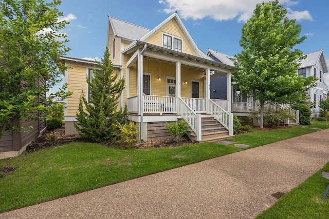 43 Center Ln, Carlton Landing, OK 74432 - view of front of home with covered porch, a front lawn, and metal roof