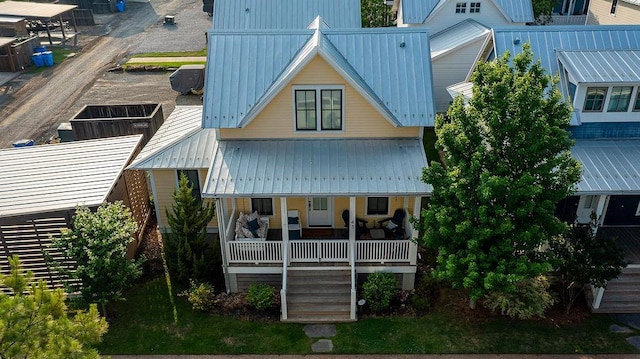 43 Center Ln, Carlton Landing, OK 74432 - rear view of house featuring a porch, metal roof, and stairway